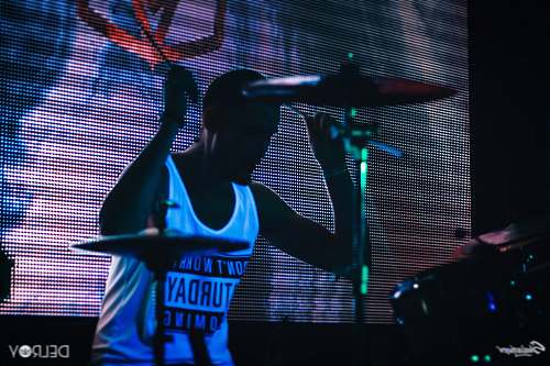 russia man playing drums infront of monitor drummer